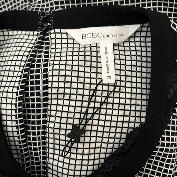 BCBGENERATION Black & White Checkered
Sheath Dress with Sheer V Neck Size XS - Picture 3 of 12
